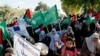 FILE - Hamas supporters protest against Israel's plan to annex parts of the West Bank and US President Donald Trump's Mideast initiative, at the Palestinian side of Erez checkpoint between Israel and Gaza, in Beit Hanoun, Gaza Strip, July 9, 2020.