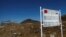 FILE - A signboard is seen from the Indian side of the Indo-China border at Bumla, in the northeastern Indian state of Arunachal Pradesh, Nov. 11, 2009. 