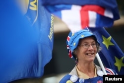 Anti-Brexit demonstrators protest outside the Houses of Parliament in London, Britain, Sept. 4, 2018.