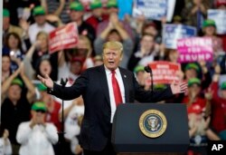 FILE - President Donald Trump speaks during a Make America Great Again rally at the Mid-America Center in Council Bluffs, Iowa, Oct. 9, 2018.