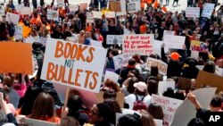 Hundreds of students gather, April 20, 2018, at the Capitol in St. Paul, Minn., to protest gun violence, part of a national high school walkout on the 19th anniversary of the Columbine shootings.