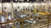 FILE - One of Amazon's distribution centers in Tracy, Calif., is seen during a tour, Nov. 30, 2014. This Amazon Fulfillment Center opened in 2013 and was refitted to use new robotics technology the next year.