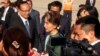 Myanmar's State Councilor Aung San Suu Kyi, center, arrives at Phnom Penh International Airport, in Phnom Penh, Cambodia, April 29, 2019.