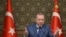 FILE - Turkish President Recep Tayyip Erdogan speaks at the presidential palace in Ankara, Turkey, Oct. 24, 2019. 