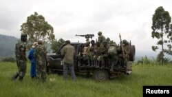 Congolese government soldiers prepare to drive from a military outpost between Kachiru village and Mbuzi hill, in eastern Democratic Republic of the Congo, May 25, 2012.