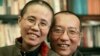 Chinese dissident Liu Xiaobo and his wife, Liu Xia, pose in this undated photo released by his family on October 3, 2010. 