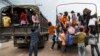 Cambodian workers ride on military trucks as they prepare to cross the Thai-Cambodia border at Aranyaprathet in Sa Kaew, June 15, 2014.