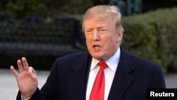 도널드 트럼프 미국 대통령이 24일 백악관 사우스론에서 특검 수사 결과에 대한 입장을 밝히고 있다.