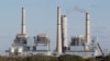 FILE- The Fayette Power Project, a coal-fired power plant, is shown in Ellinger, Texas, Dec. 15, 2010. Some environmentalists, ranchers and scientists linked tree deaths in the area to sulfur dioxide emissions from the plant.