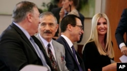 Secretary of State Mike Pompeo, left, U.S. Ambassador to South Korea Harry Harris, Treasury Secretary Steve Mnuchin and White House Adviser Ivanka Trump chat together before a news conference by President Donald Trump and South Korean President Moon…