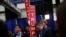 A campaign staffer holds a sign near where Republican U.S. presidential nominee Donald Trump (not pictured) talks to reporters in the spin room after his first debate against Democratic U.S. presidential nominee Hillary Clinton at Hofstra University in He
