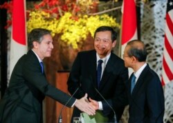 FILE - U.S. Deputy Secretary of State Antony Blinken, left, Japanese Vice Foreign Minister Akitaka Saiki, center, and First Vice Minister of Foreign Affairs of South Korea Lim Sung Nam conclude a news conference in Tokyo on January 2016.