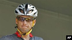 Lance Armstrong grimaces prior to the start of the third stage of the Tour de France cycling race in Wanze, Belgium, July 6, 2010 (file photo)