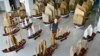 Planner and explorer Jin Feibao poses for pictures with his models of the full fleet led by Ming Dynasty eunuch explorer Cheng Ho, also known as Zheng He, in Kunming, Yunnan province, July 11, 2014.