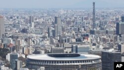 نمایی از استادیوم جدید ملی ژاپن که برای المپیک ۲۰۲۰ توکیو ساخته شده است - آرشیو