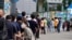 People wait for coronavirus testing at a testing site in Seoul, South Korea, July 7, 2021.
