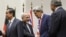 FILE - Iranian Foreign Minister Mohammad Javad Zarif (2nd L) shakes hands with U.S. Secretary of State John Kerry next to Chinese Foreign Minister Wang Yi (far L) and French Foreign Minister Laurent Fabius (far R) after a statement on early November 24, 2013.