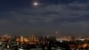 In this photo released by the Syrian official news agency SANA, shows missiles flying into the sky near international airport, in Damascus, Syria, Jan. 21, 2019