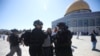 Israeli police arrests a Palestinian worshipper at al-Aqsa mosque compound in Jerusalem, Aug. 11, 2019.