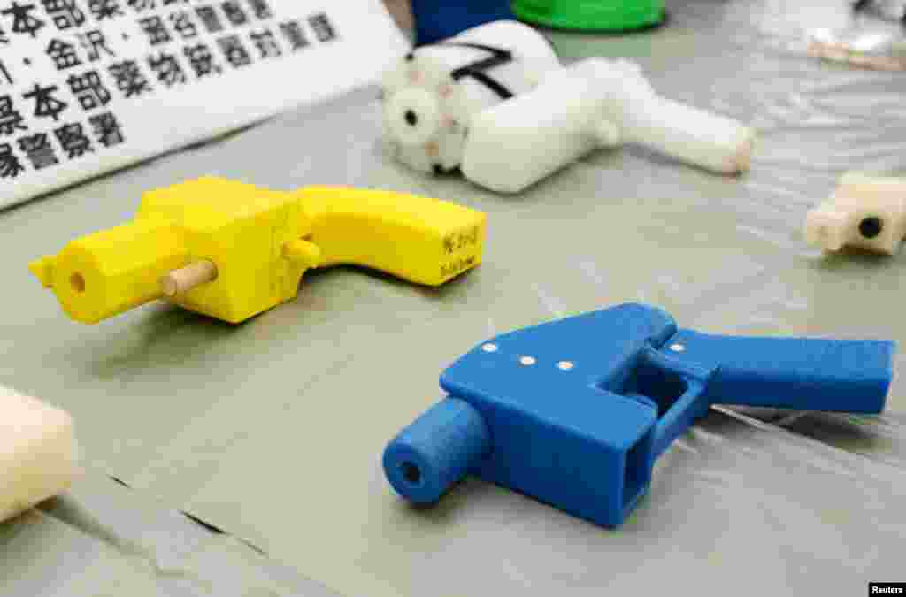 Seized plastic handguns created, using 3D printing technology, are displayed at Kanagawa police station in Yokohama, south of Tokyo, Japan.