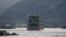 FILE - Chinese cargo ships sail on the Mekong River near the Golden Triangle at the border between Laos, Myanmar and Thailand, March 1, 2016.