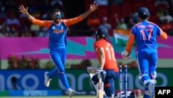 প্লেয়ার অফ দ্য ম্যাচ ভারতের আক্সার প্যাটেল ইংল্যান্ডের মঈন আলীর উইকেট নিয়ে আনন্দ করছেন। ফটোঃ ২৭ জুন, ২০২৪। 