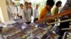 Cambodian villagers walk to enter a courtroom before the first appeal hearings against two former Khmer Rouge senior leaders, Khieu Samphan and Nuon Chea, at the U.N.-backed war crimes tribunal in Phnom Penh, Cambodia, Thursday, July 2, 2015. 