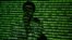 An illustration picture shows a projection of binary code including cyrillic words onto a man, taken in Warsaw October 8, 2014. 