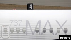 FILE - A Boeing 737 MAX 8 aircraft is parked at a Boeing production facility in Renton, Washington, March 11, 2019. 
