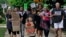 FILE - Jackson Borrello, 8, leads activists with a Tuesdays with Tillis rally outside U.S. Senator Tom Tillis' office at the Federal Building to demand the reunification of families separated at the border in Raleigh, N.C., June 26, 2018.