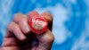 FILE - A pin reading "Stop TB" is shown after presentation of WHO report Global Tuberculosis Control at the United Nations headquarters, Geneva, Switzerland