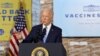 FILE - President Joe Biden gestures as he delivers remarks on the importance of COVID-19 vaccine requirements, during a visit at a Clayco construction site, in Elk Grove Village, Illinois, Oct. 7, 2021. 