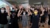 Protesters gesture with five fingers, signifying the "Five demands - not one less" outside a court during a protest in Hong Kong, Thursday, Aug. 27, 2020. Hong Kong police arrested 16 people, including two opposition lawmakers, on Wednesday on…
