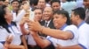 CPP supporters take a selfie with Heng Samrin, National Assembly president attends the 65th annual celebration of ruling party Cambodian People's Party (CPP) establishment on Tuesday, June 28, 2016, at CPP's headquarter in Phnom Penh. (Leng Len/VOA Khmer) 