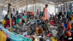South Sudanese shelter in a transit center in Renk, South Sudan Wednesday, May 17, 2023. (AP Photo/Sam Mednick)