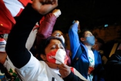 Supporters of presidential candidate Keiko Fujimori cheer as they listen to the results of an unofficial exit poll on the runoff election, in Lima, Peru, June 6, 2021.