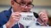 Census Bureau Director Steven Dillingham holds up his mask with the words '2020 Census' as he testifies before a House Committee on Oversight and Reform hearing on the 2020 Census​ on Capitol Hill, July 29, 2020, in Washington. 