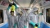 Workers disinfect subway trains against coronavirus in Tehran, Iran, in the early morning of Wednesday, Feb. 26, 2020. Iran's government said Tuesday that more than a dozen people had died nationwide from the new coronavirus, rejecting claims of a…