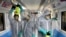 Workers disinfect subway trains against coronavirus in Tehran, Iran, in the early morning of Wednesday, Feb. 26, 2020. Iran's government said Tuesday that more than a dozen people had died nationwide from the new coronavirus, rejecting claims of a…