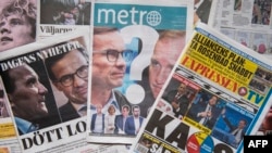 A photo taken on September 10, 2018 in Stockholm shows a selection of front pages of Swedish newspapers in Stockholm a day after the general elections.