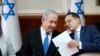 Israeli Prime Minister Benjamin Netanyahu, left, and Cabinet Secretary Tzahi Braverman attend the weekly Cabinet meeting at his office in Jerusalem, Dec. 1, 2019. 