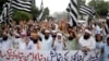 Pakistani protesters shout slogans to condemn a cartoon contest by Dutch parliamentarian, in Lahore, Pakistan, Aug. 17, 2018. 