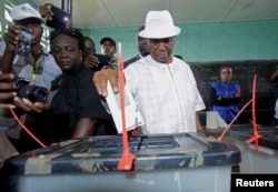 FILE - Joseph Nyuma Boakai votes at a polling station in Monrovia, Liberia.