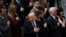 President Donald Trump signs the National Anthem during a National Prayer Service at the National Cathedral, in Washington, Jan. 21, 2017. 