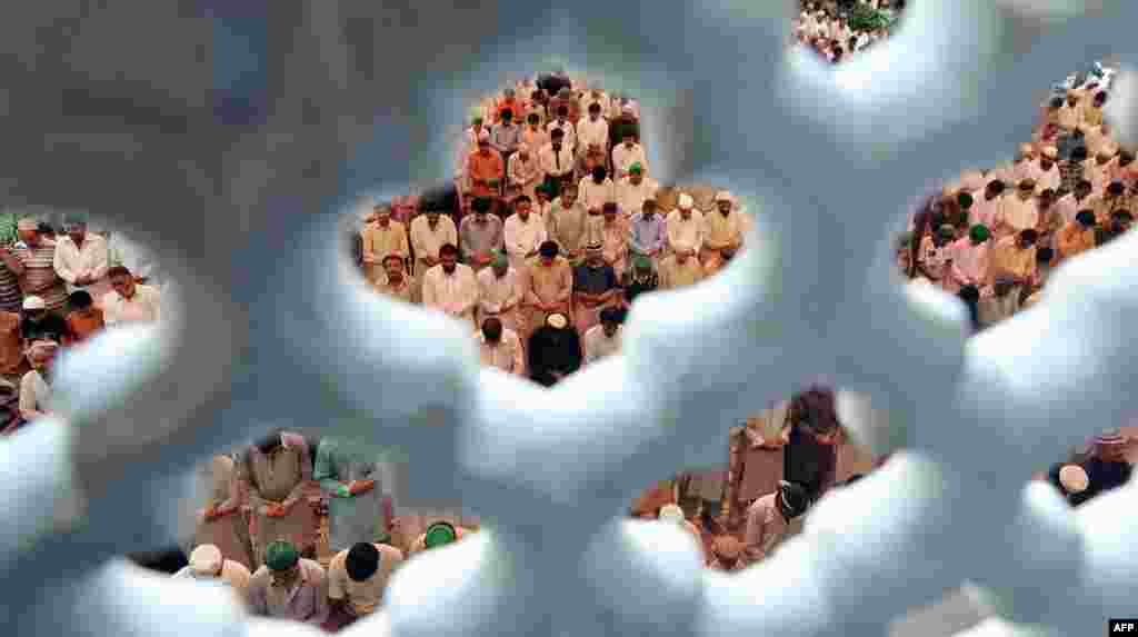 Pakistani Muslims offer Friday prayers at mosque during the month of Ramadan in Lahore. 