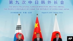 中日韩三国外长联合记者会。（2019年8月21日）