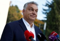 FILE - Hungarian Prime Minister Viktor Orban talks to the media in Budapest, Hungary, Oct. 13, 2019.
