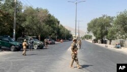 FILE - Afghan police arrive at the site of an explosion in Kabul, Afghanistan Thursday, July 25, 2019. 