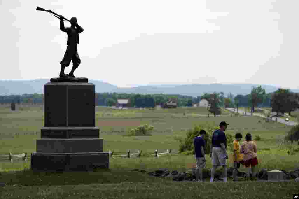 FILE - A monument sits atop a ridge held by Union troops, above the field of Pickett's Charge, Wednesday, June 5, 2013, in Gettysburg, Pa. 
