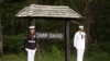 Members of an honor guard stand at attention at Camp David, Md. (file photo).